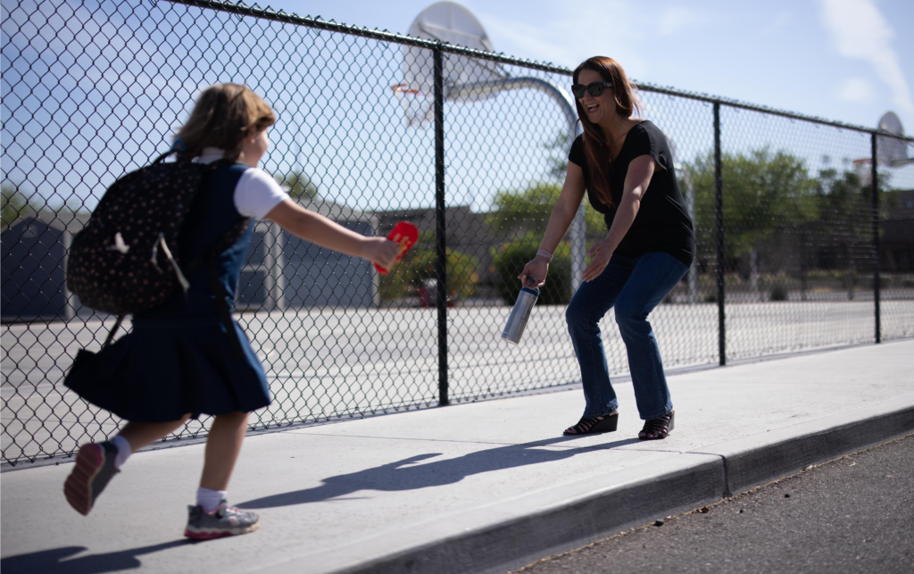 A Woman Picks Up Her Kid From School While Maintaining Healthy Weight Loss Habits