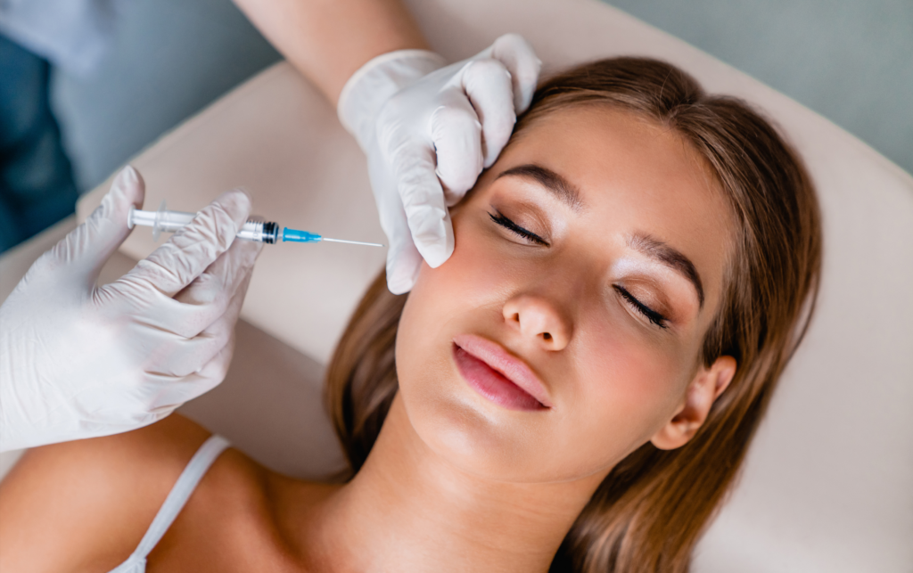 A Woman Closes Her Eyes and Gets a Med Spa Treatment