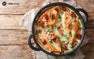 Close-up of Creamy Chicken dish featuring Sun Dried Tomatoes and fresh Spinach