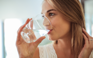 A Woman Staying Hydrated in Cooler Weather, helping with weight loss in Arizona’s dry climate