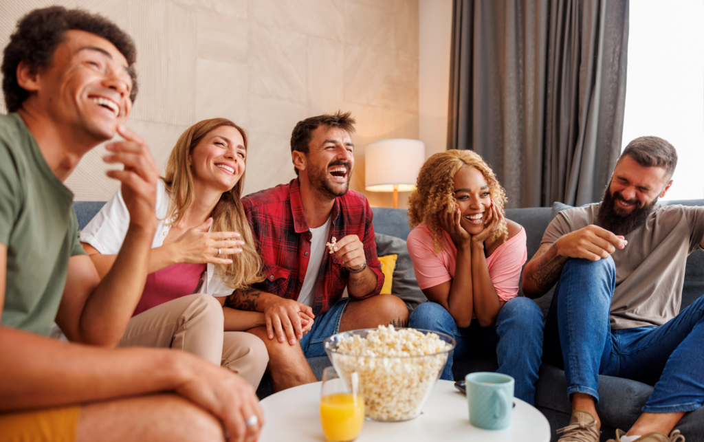 A Group of Young People Eating Healthy Football Snacks