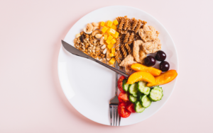 meal timing and weight loss concept with food on a plate that looks liek clock